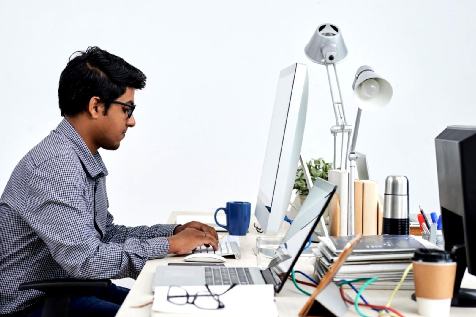 Developer analyzing business workflow and requirements on whiteboard